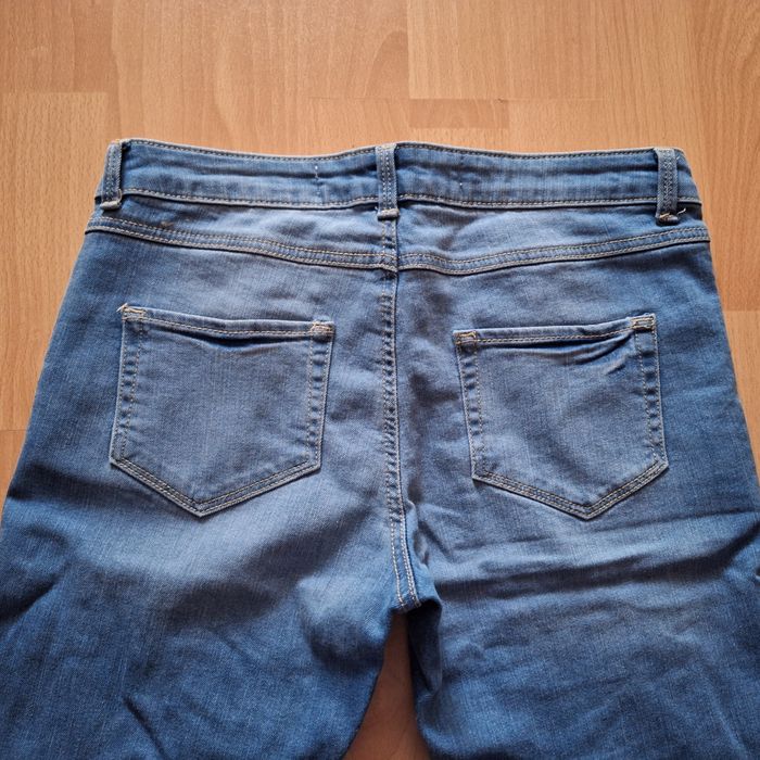 Spodnie damskie jeansy z dziurami 36 S