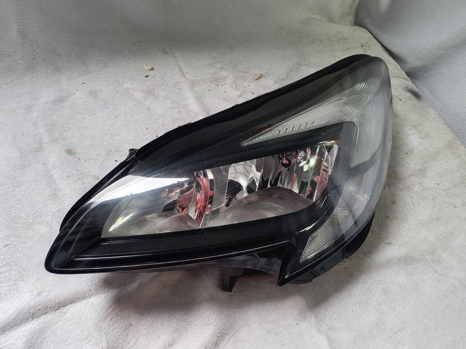 Lampa lewa zwykła Opel Corsa E Europa reflektor przedni