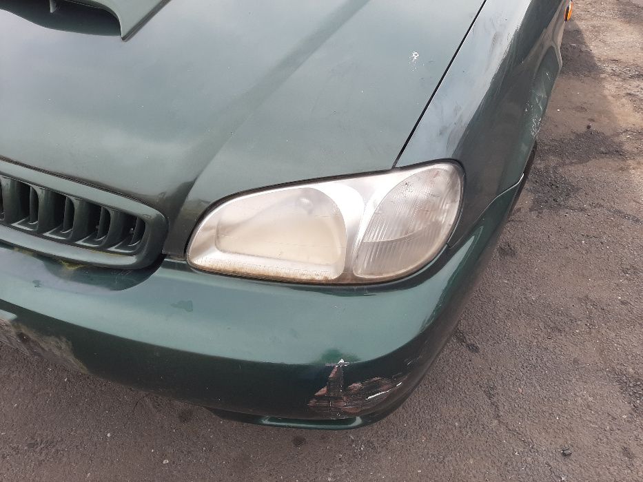 Kia Carnival I 2.9 DOHC 16V TDI 2001r. Lampa lewa przednia
