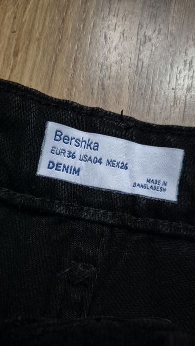Spodnie z dziurami czarne bershka r 36
