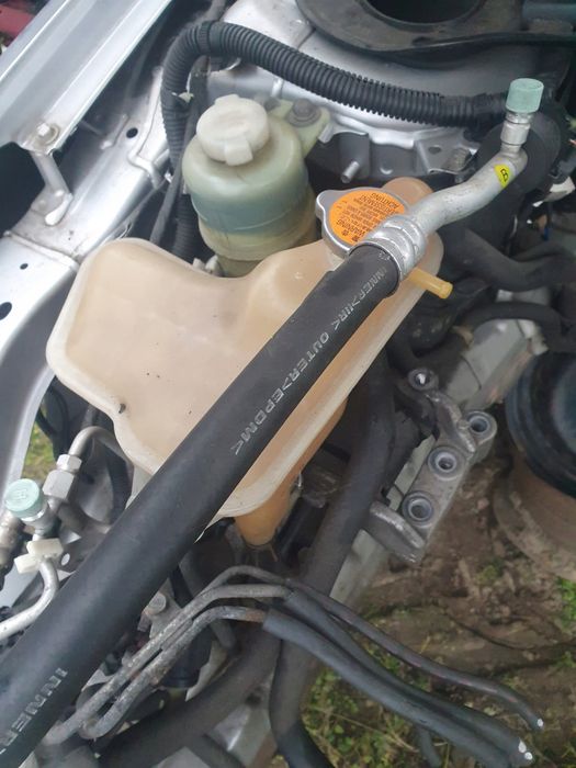 mitsubishi lancer viii 09r - zbiornik płynu wspomagania