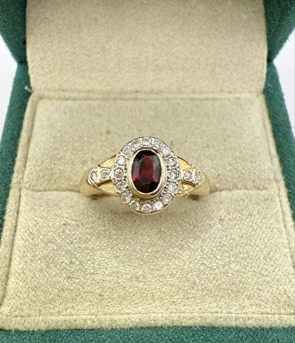 Złoty pierścionek 585 z granatem 0,50ct i diamentami 0,20ct