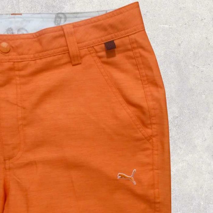 Puma pomarańczowe spodnie sportowe W32L32
