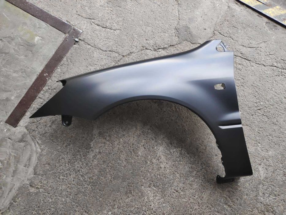 Крило ліве праве левое правое 
MITSUBISHI LANCER IX 04-08 (CS)