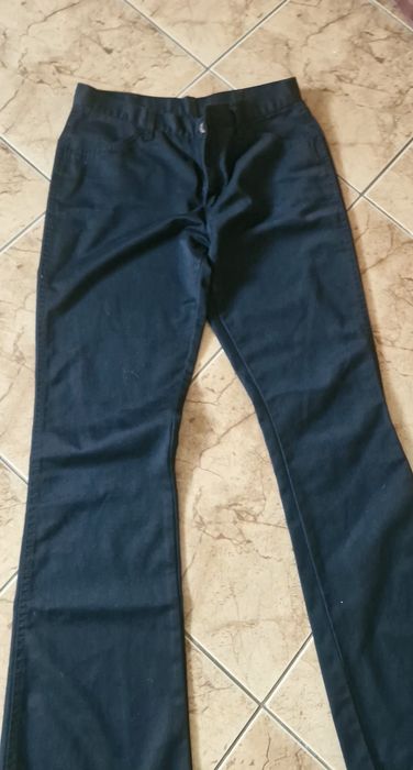 Spodnie wrangler model z szeroką nogawka rozm 33 - 34