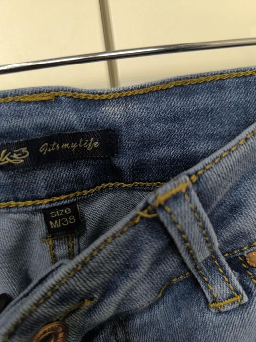 Spodnie jeansy wysoki stan skinny rurki dżinsy 10 M 38 szarpane nogawk