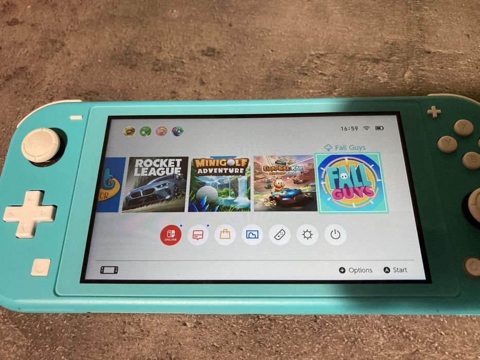 Nintendo Switch Lite 128 GB * stan jak nowy * oryginalna ladowarka *