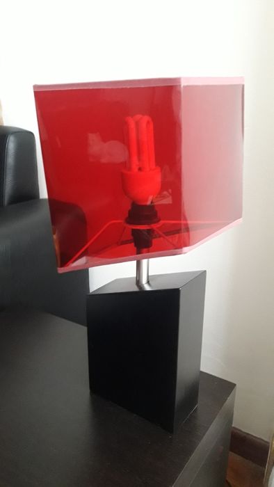 Table lamp with red lampshade