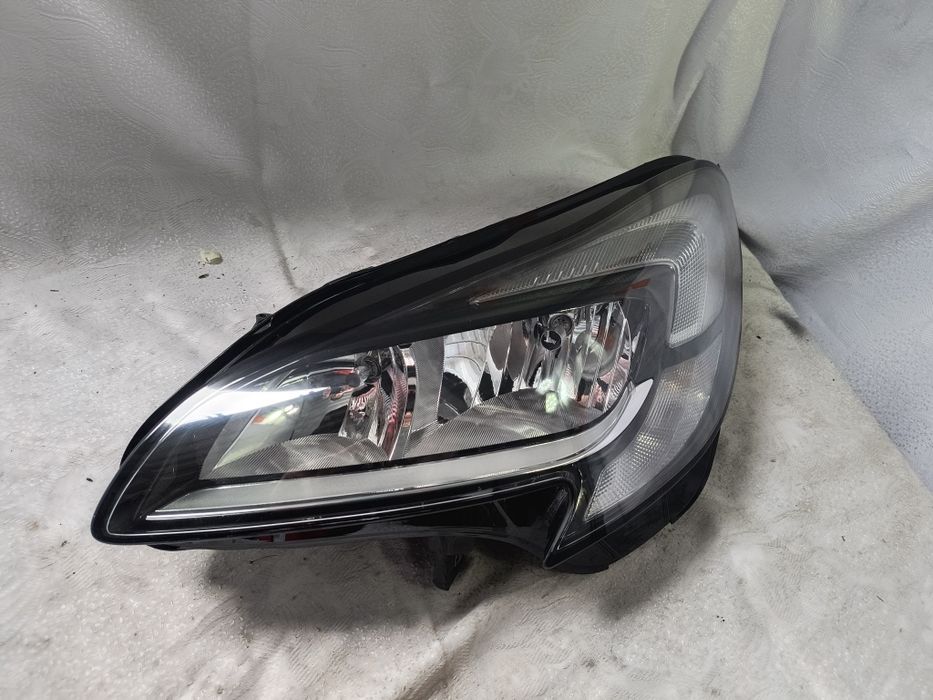 Lampa lewa zwykła Opel Corsa E Europa reflektor przedni