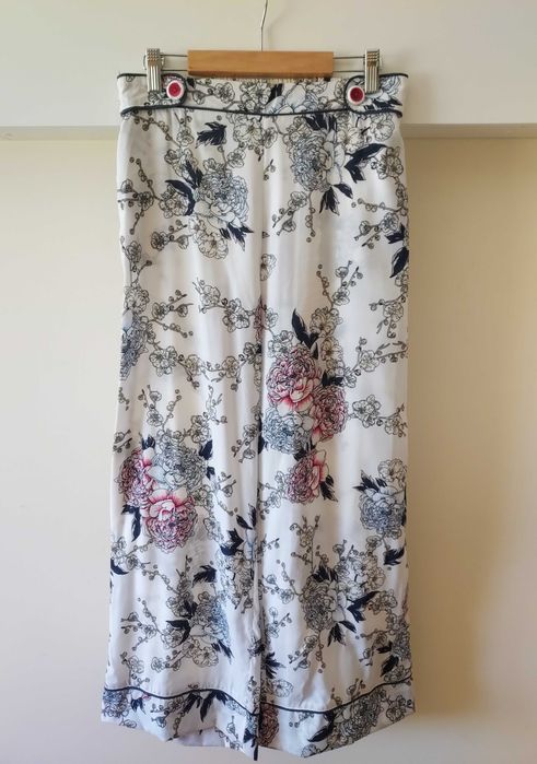 Calças estampadas brancas com bolsos