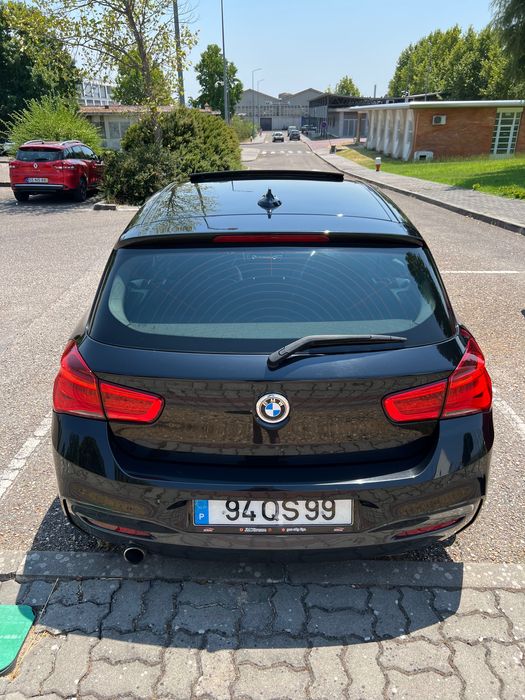 BMW 116 coupé com teto de abrir.