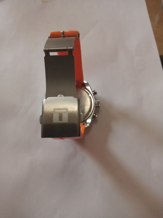 Zegarek marki Tissot srebrno pomarańczowy