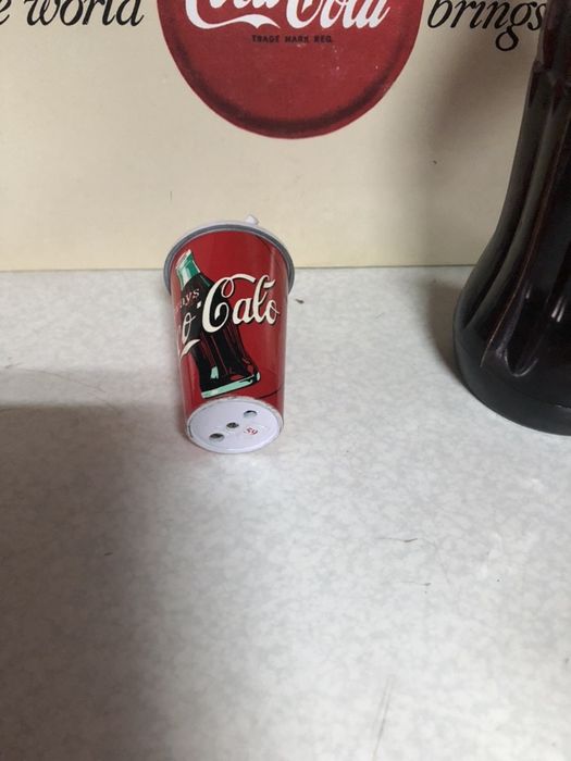 Coca cola. Caco calo. Isqueiro