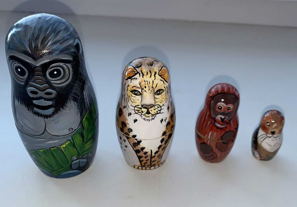 Фирменная игрушка-матрешка