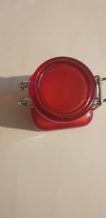 Świeca o  zapachu cynamonu  w szklannej buteleczce