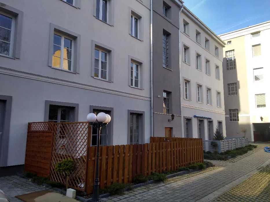 Nowoczesna, stylowa kawalerka w loftowym klimacie przy Manufakturze