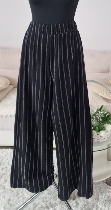 Spodnie szerokie nogawki H&M".