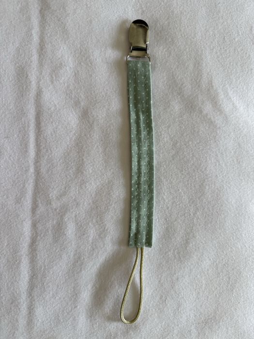 Prendedor de chucha novo