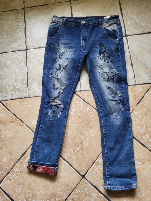 Spodnie dżinsowe L z ozdobnymi mankietami