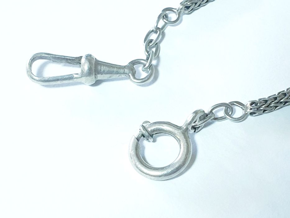 Antigo corrente de relógio de bolso em prata contrastada