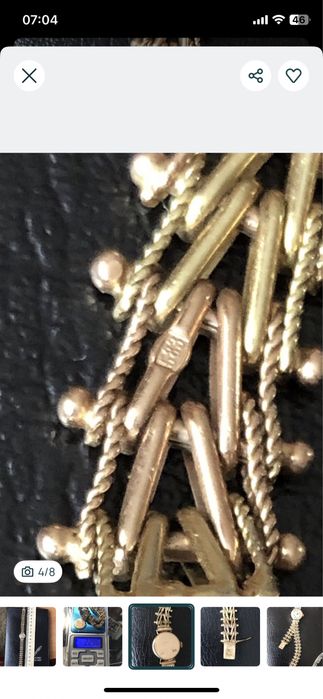 Золотые женские часы.