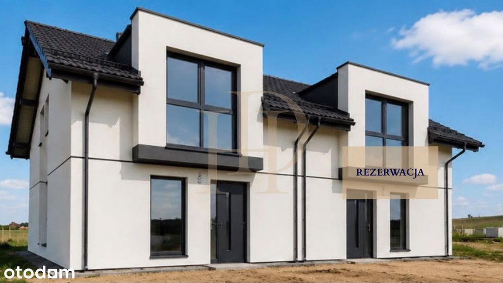 Dom w zabudowie bliźniaczej z wiatą i ogrodem