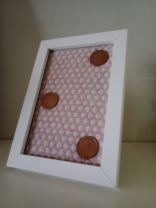 Moldura com moedas antigas