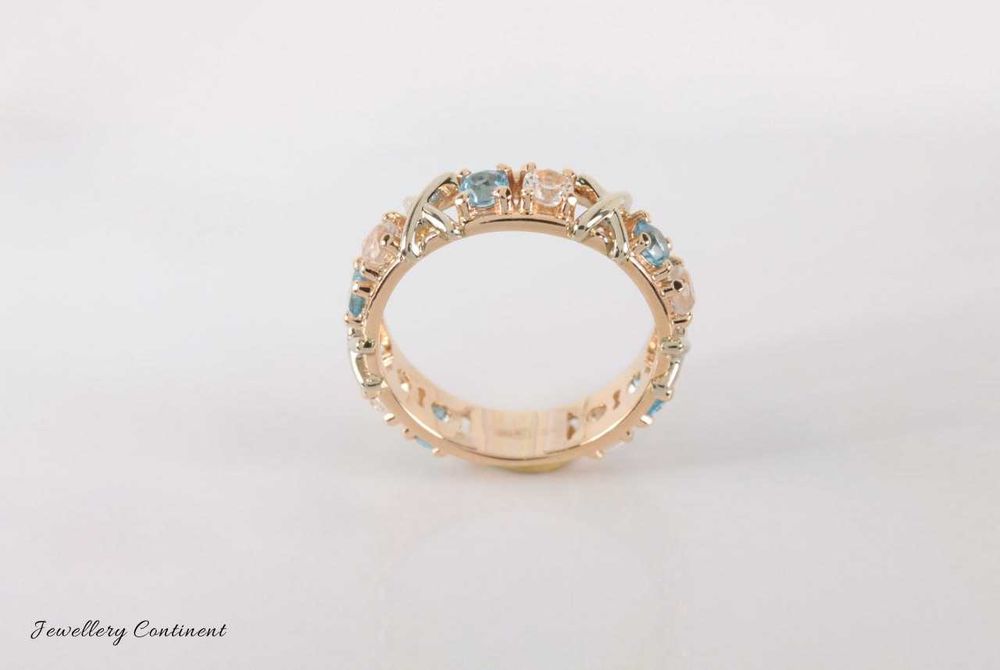 Кольцо из золота с топазами