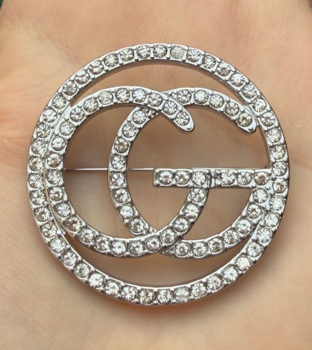 Broszka Gucci srebrna z cyrkoniami