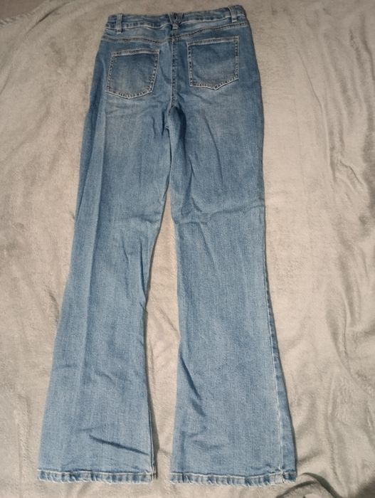 Сині кльош джинси