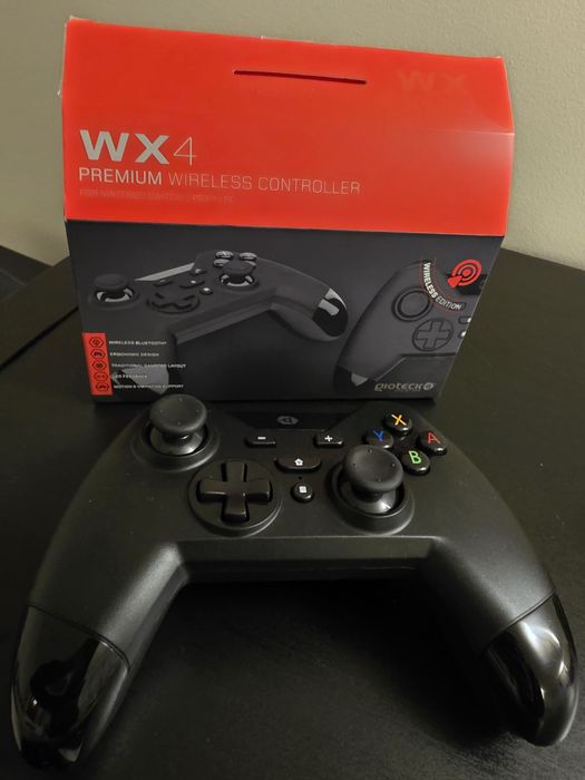 Nintendo Switch usada + jogos + comando wireless