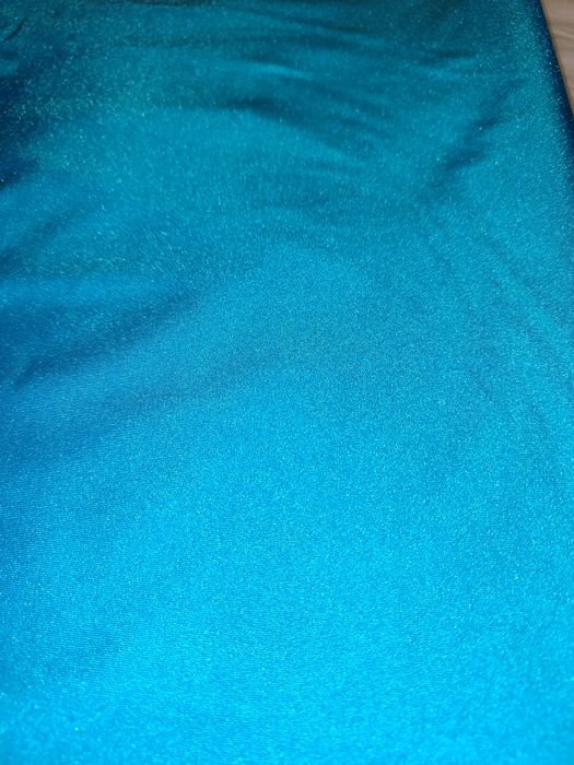 Peça de tecido em lycra azul turquesa