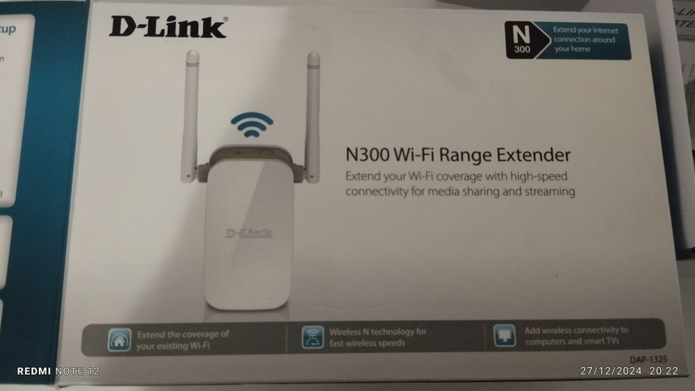 Repetidor d link com a caixa e os manuais de intrucoes.