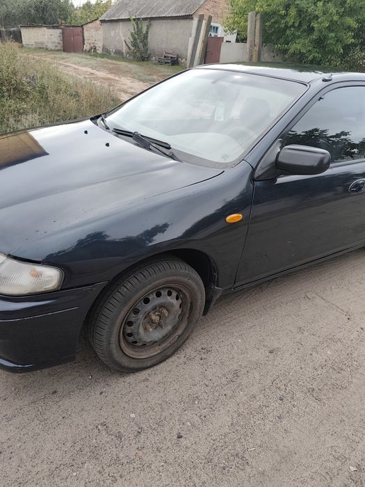 Mazda 323 1998 год