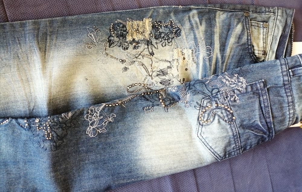 Nowe spodnie jeansy 40