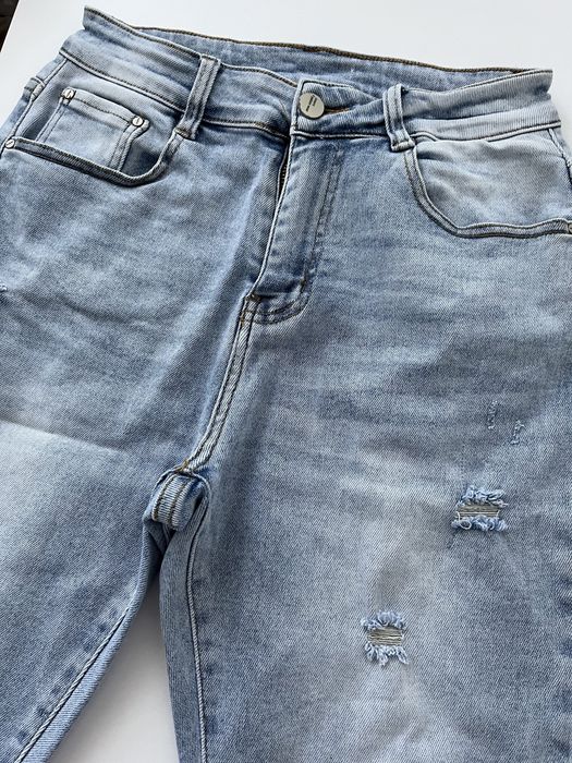 Spodnie damskie jeansowe denim z przetarciami wysoki stan rurki M