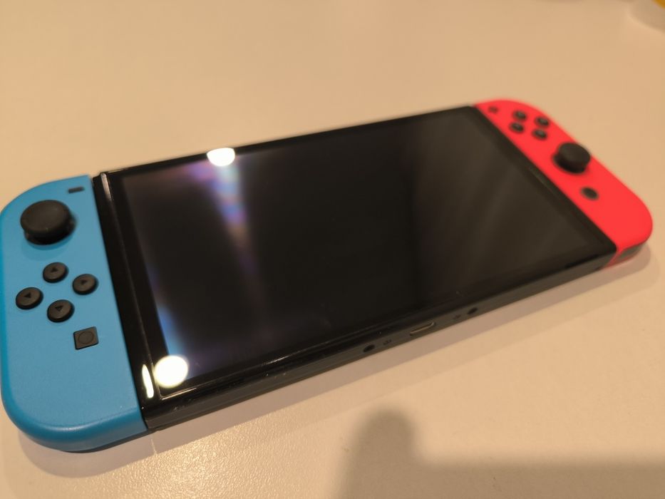 Nintendo Switch OLED with Neon Blue and Neon Red