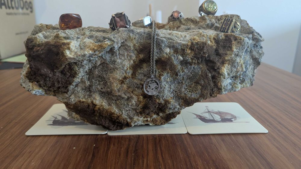 big beautiful rock (copper, silver, granite) to display jewelry or other items