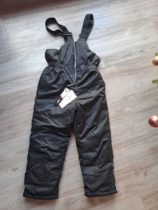 Ocieplane spodnie 134 chłopięce nowe narciarskie odblaski