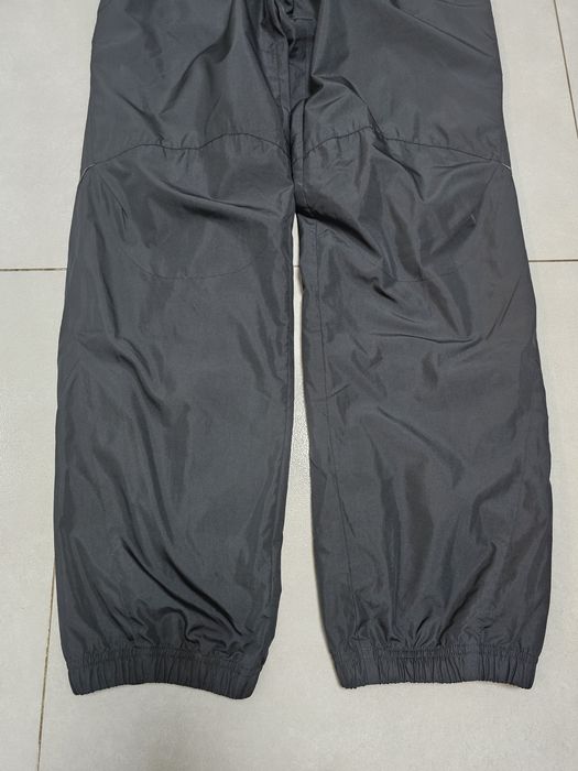 Nike Sportswear spodnie do biegania roz.M wodoodporne