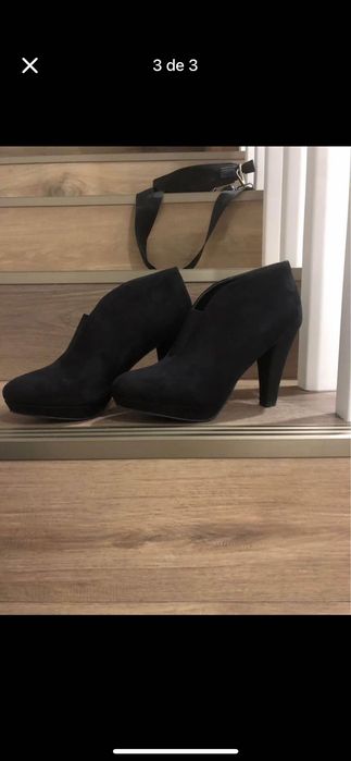 Botins pretos, em perfeito estado.