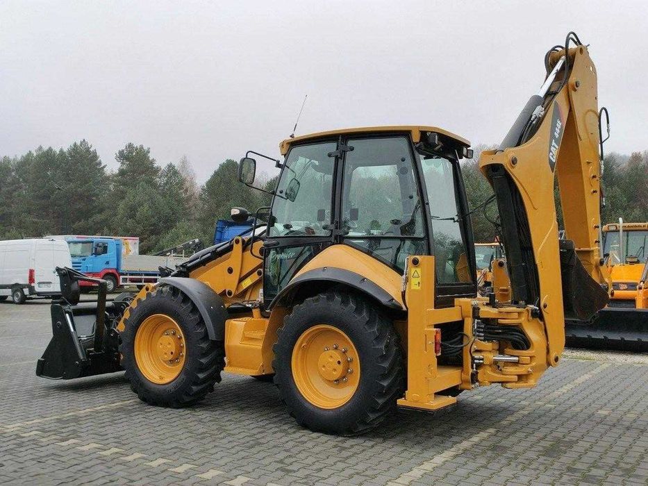 Екскаватор-навантажувач Caterpillar 444E