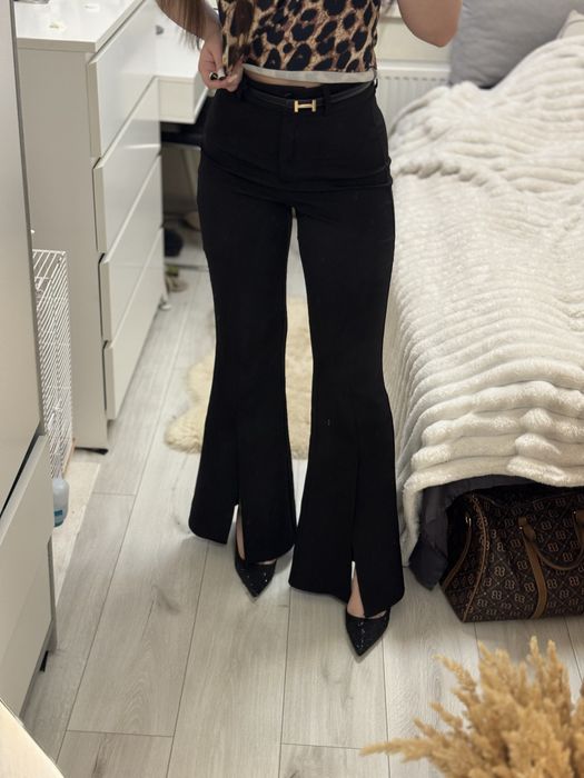 Брюки клеш з розрізом