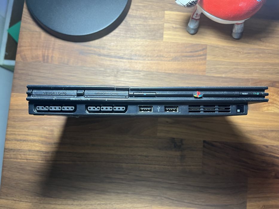 Playstation 2 com comando e acessorio para cantar