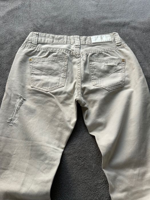 Spodnie przecierane River Island r. 34