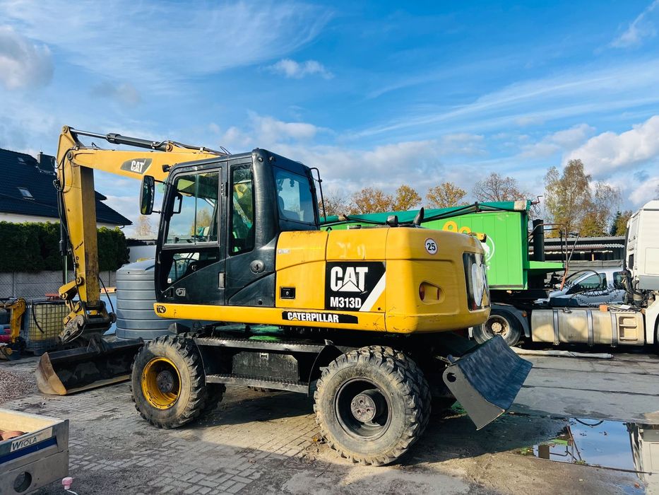 Caterpillar M313D  Pierwszy wl, salon Polska