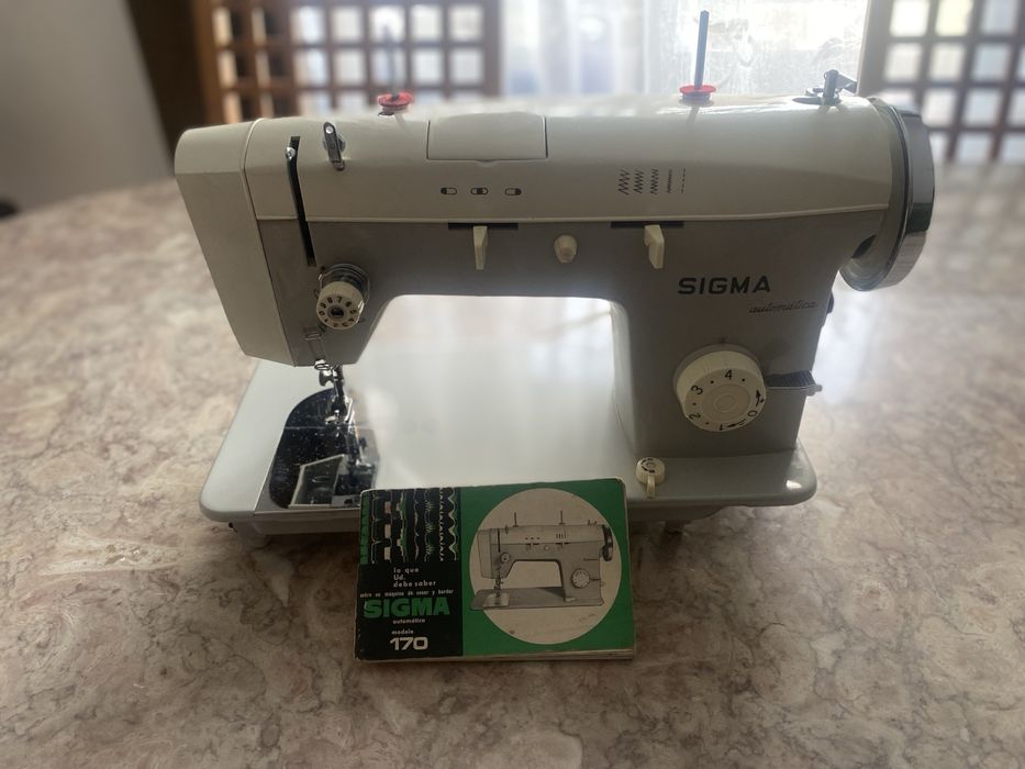 Maquina de cozer e bordar automatica