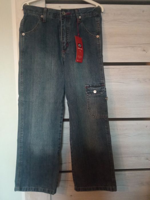 Nowe spodnie jeansowe chłopięce 134