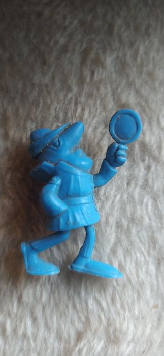 Boneco monocromático antigo