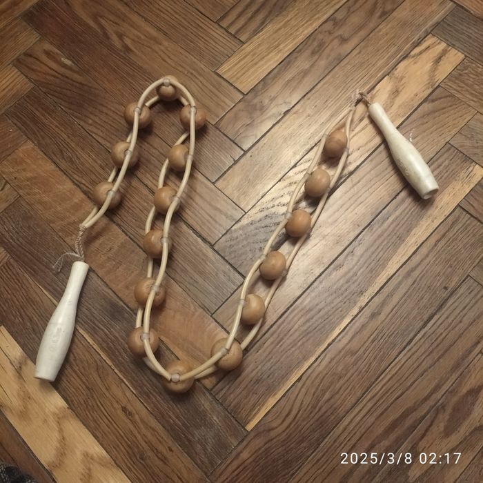 Ручний роликовий масажер.